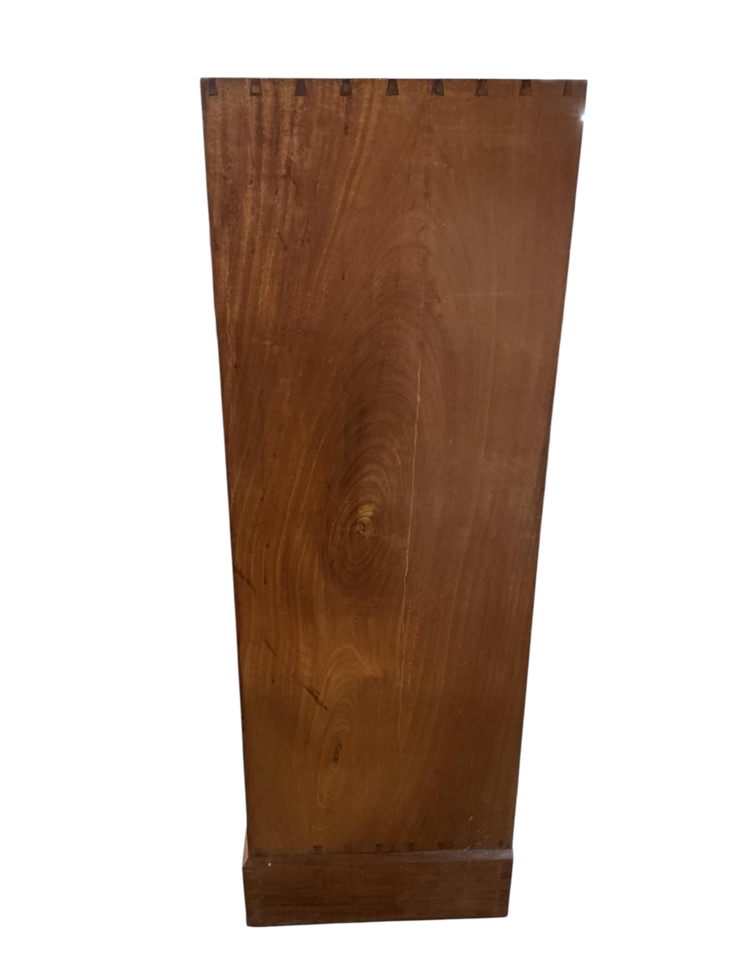 Manner of Gordon Russell, a mid century teak two door compactum, width 99cm, depth 44cm, height 130cm